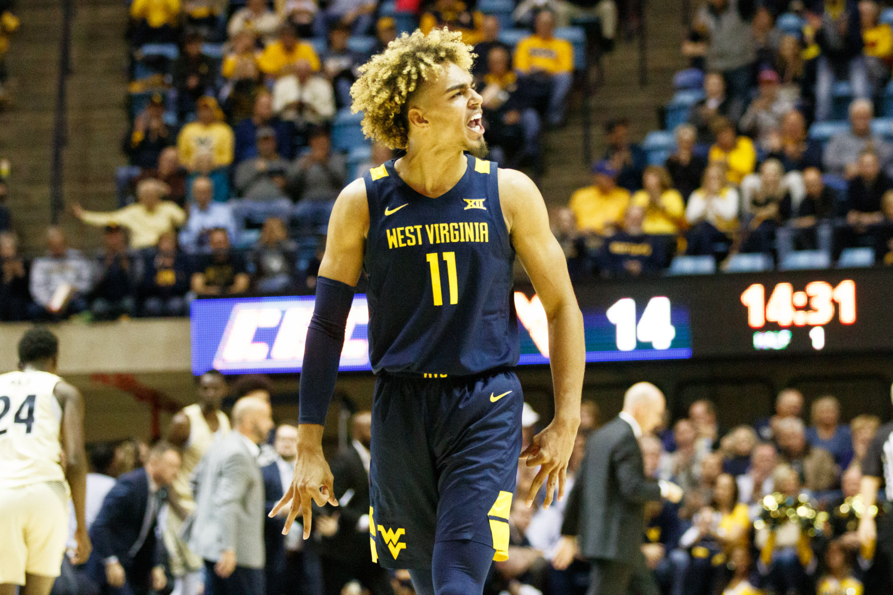 West Virginia's Emmitt Matthews Jr. celebrates a three pointer during West Virginia's season opener against Akron on Nov. 8, 2019 at the WVU Coliseum.